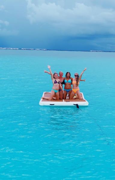 The Girls getting towed behind in Isla Mujeres.